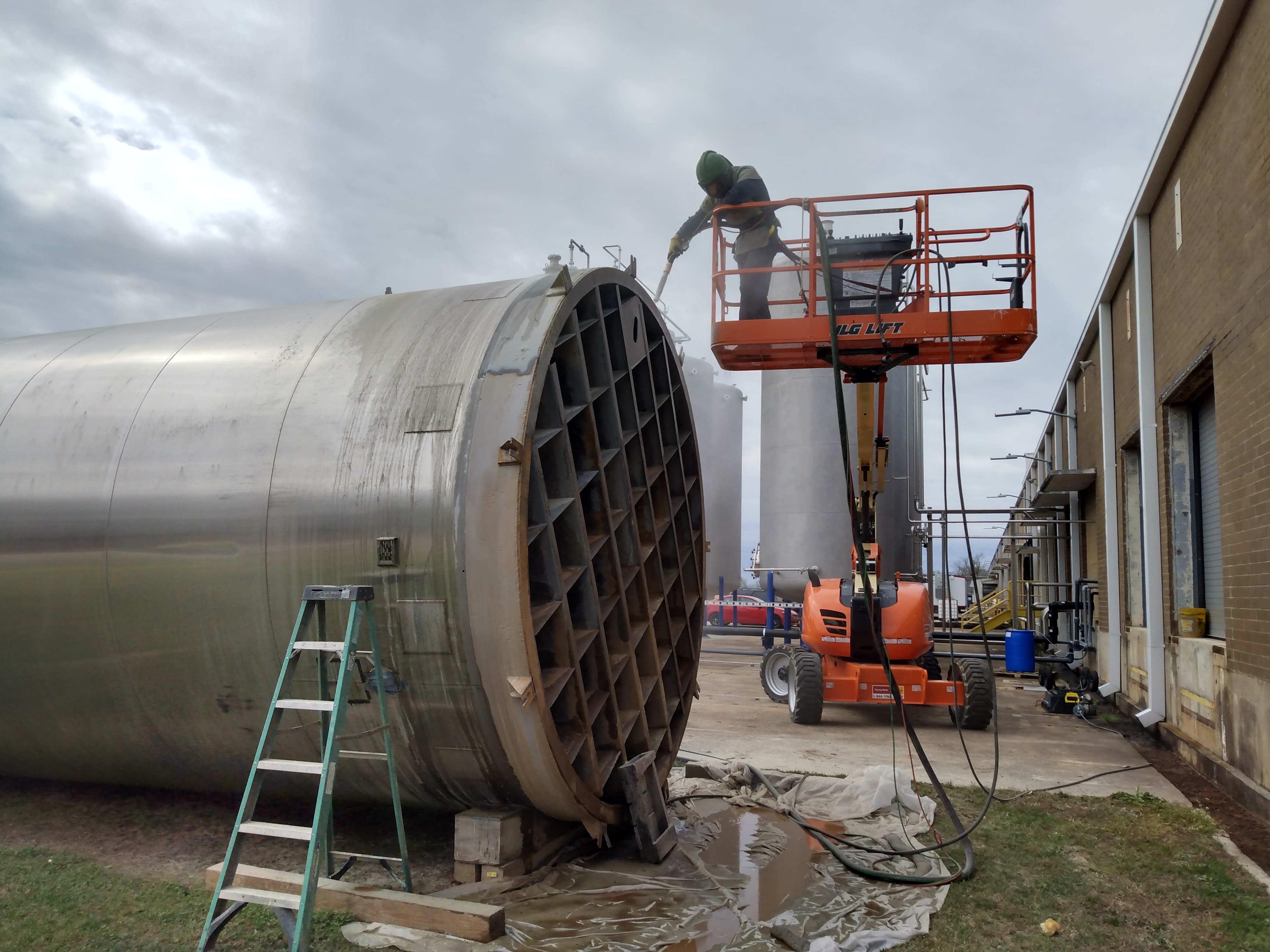 Removing corrosion on industrial silo. Athens, Georgia